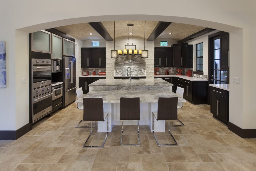 The Kitchen in Villa Sirena, an Orlando Custom Home that is a blend of Spanish Mission Architecture and Contemporary design elements by Orlando Custom Home Builder Jorge Ulibarri of Cornerstone Custom Construction