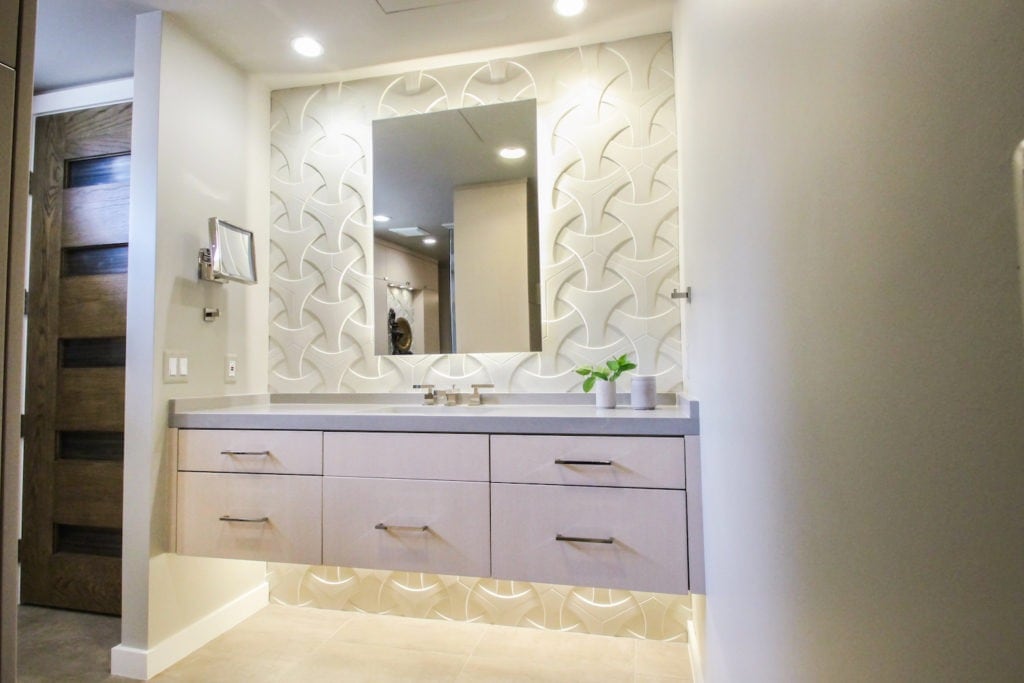NKBA award-winning bathroom designed by Andrea Lupo features the popular floating vanity and under cabinet lighting.