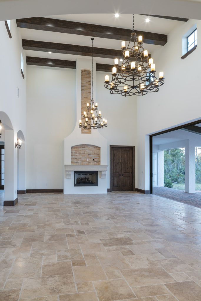 The 20-foot fireplace in the great room features an inlaid brick design that echoes the home's brick barrel ceilings throughout. 
