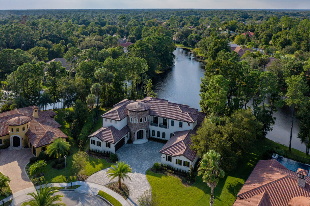 Mod-Mediterranean Custom Home by Orlando Custom Homebuilder Jorge Ulibarri. The 5,700 square foot home resides on a lake in the gated community of Lake Forest in Sanford, Florida. 
